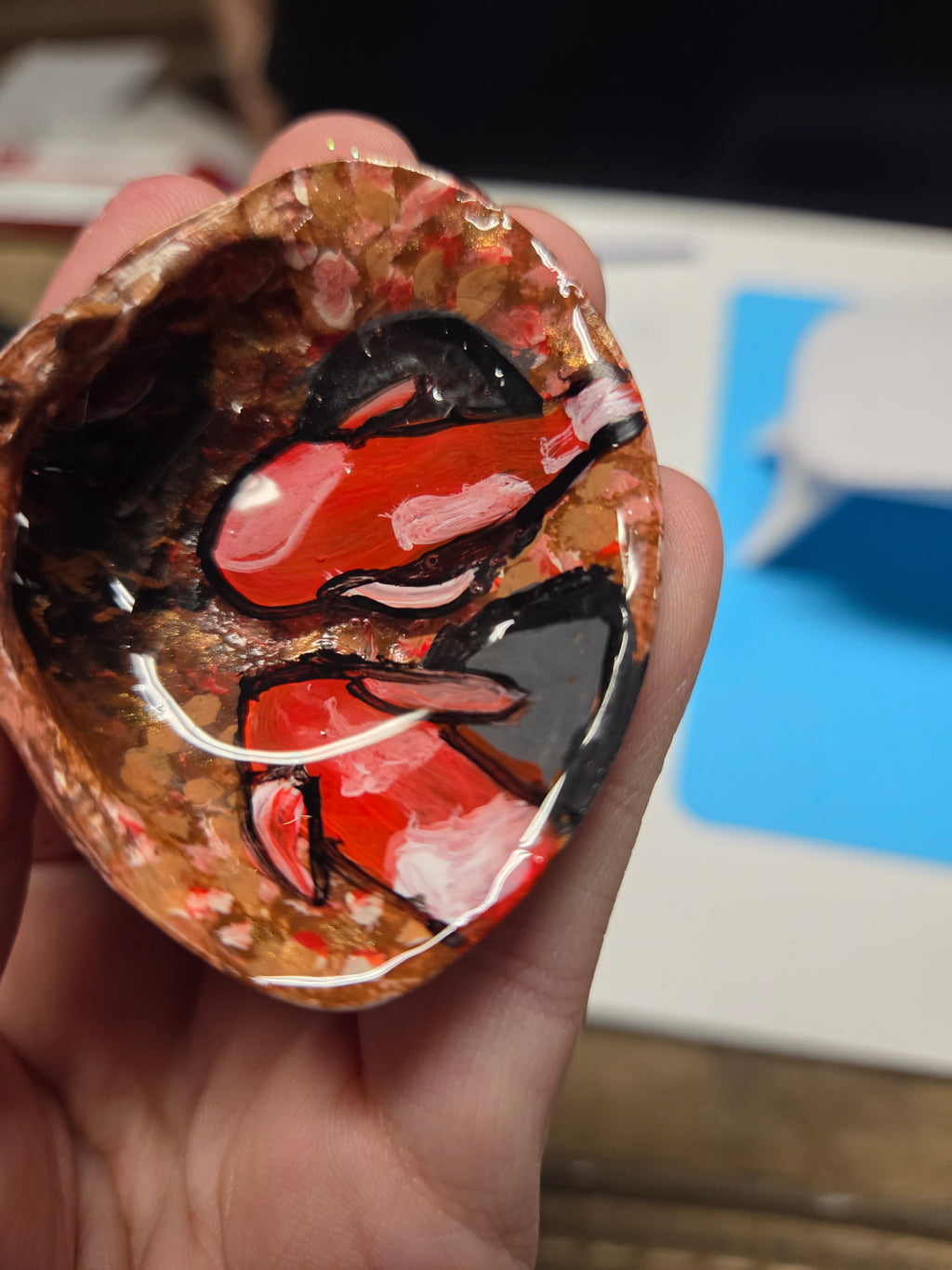 Swimming gold fish in sea shell.